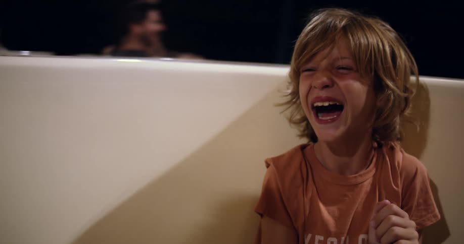 A child is having fun on the amusement park ride