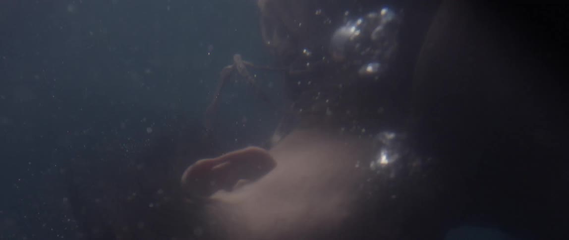 A woman is struggling underwater