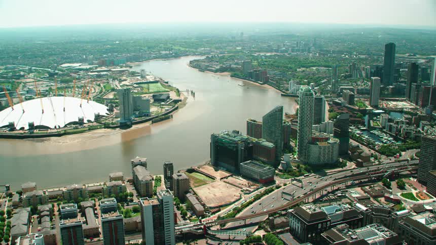 Aerial view of the thames river winding through london at daytime
