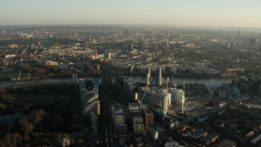 A river running behind office buildings in a city