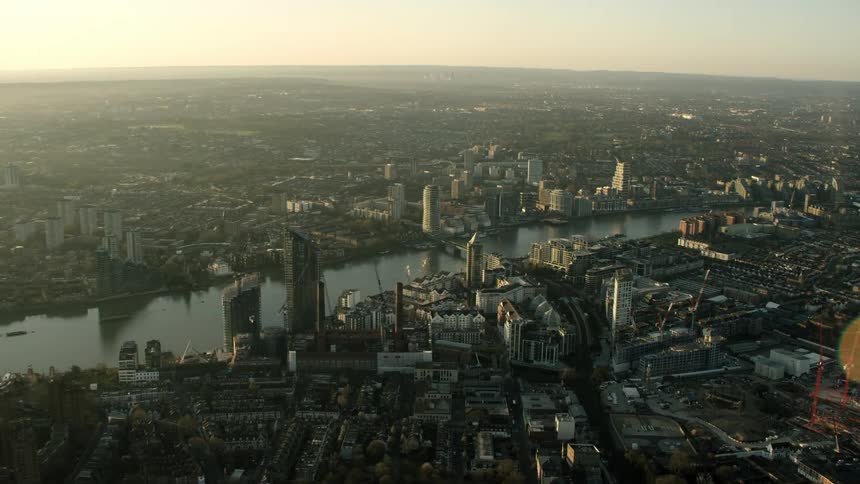 Aerial view of river thames with buildings and skyline in london at dusk