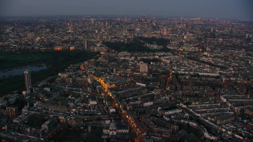 Aerial view of a downtown city during the night is displayed