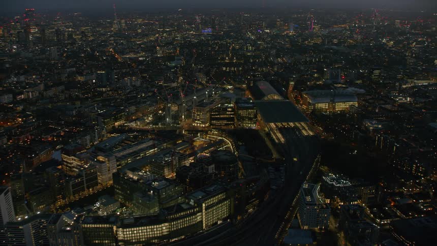 Brightly lit city stretches to horizon at night