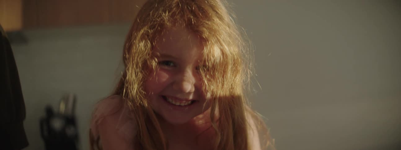 A young girl is laughing