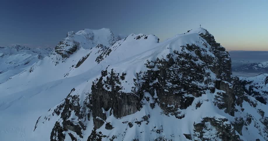 An aerial view of snow covered mountains