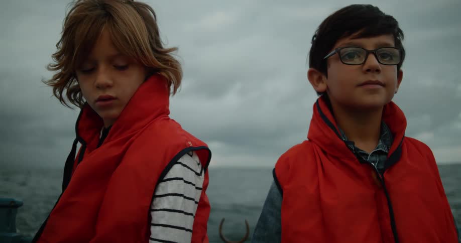 Two children are by the water