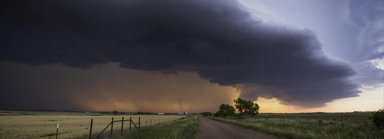 Time lapse of dark storm thunderstorm clouds rolling over the countryside at daytime