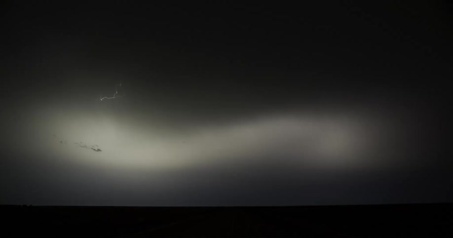 Time lapse of an intense thunderstorm over a field at night