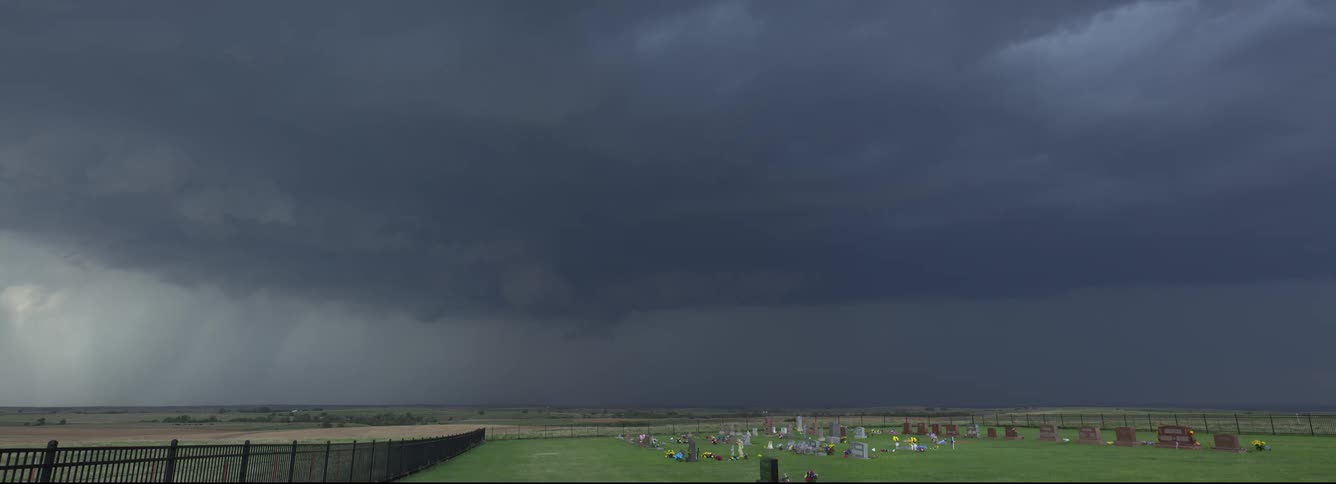 Storm clouds moving over a cemetery
