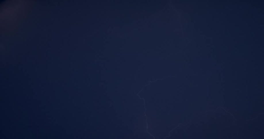 Time lapse of an intense thunderstorm with lightning streaking through the sky at night