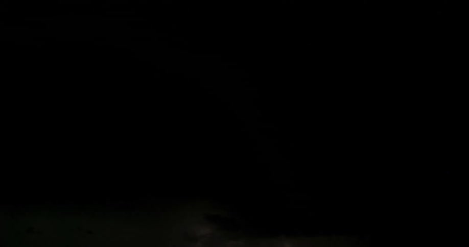 Flashes of lightning in a dark stormy sky at night