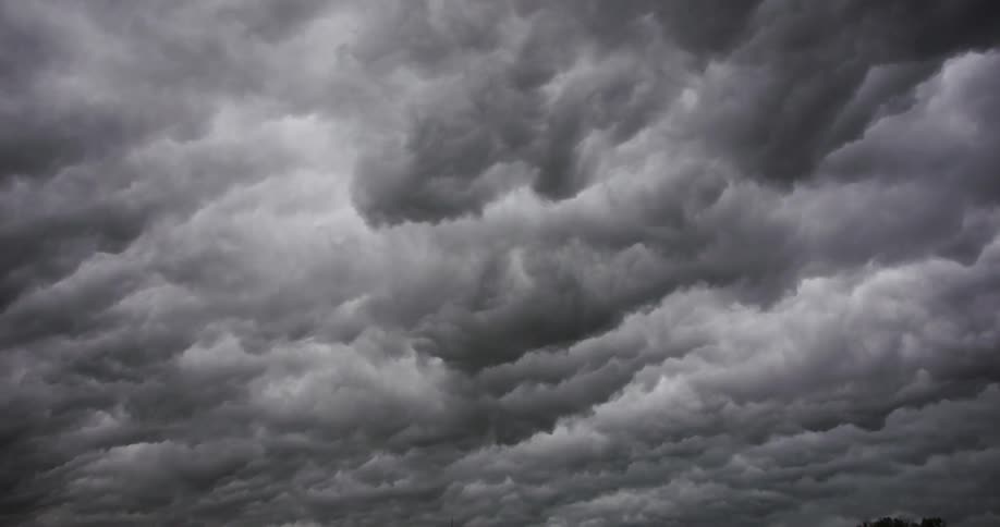 Time lapse of a dramatic dark cloud formation billowing on the sky