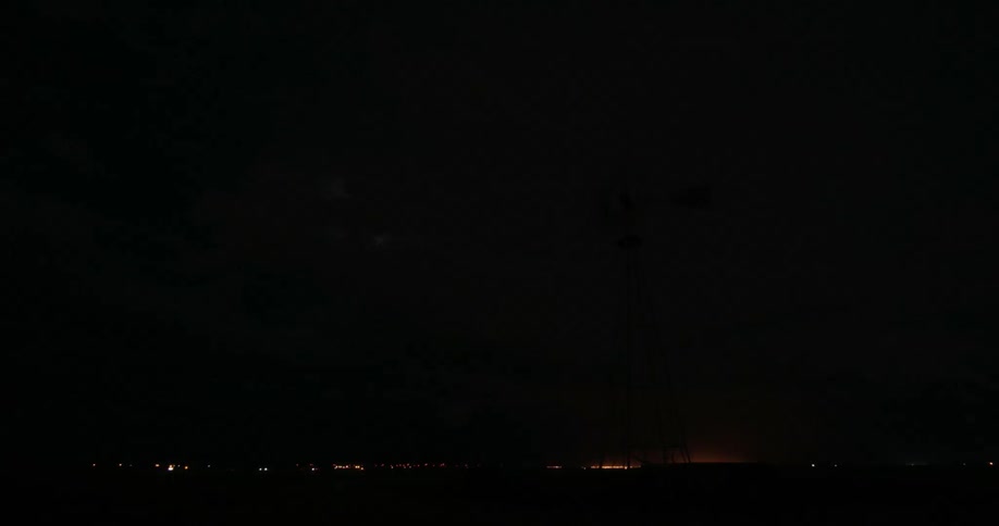 Large lightning strikes in a dark cloudy sky
