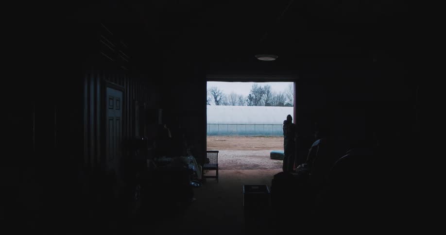 Farmer opens the barn to start the day