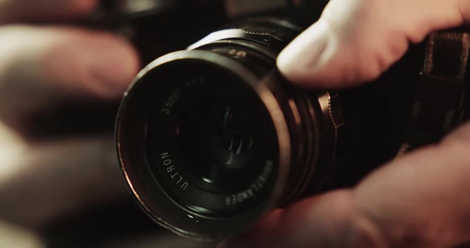 A person using a lens on a camera