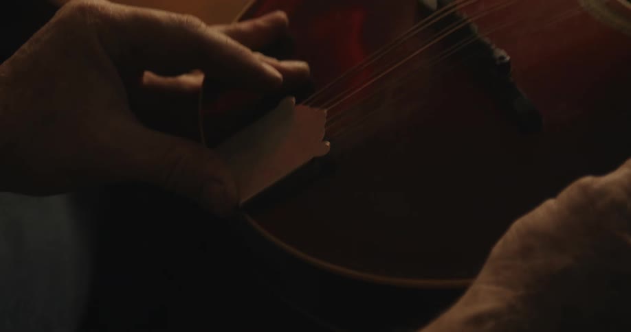 A person is holding a musical instrument