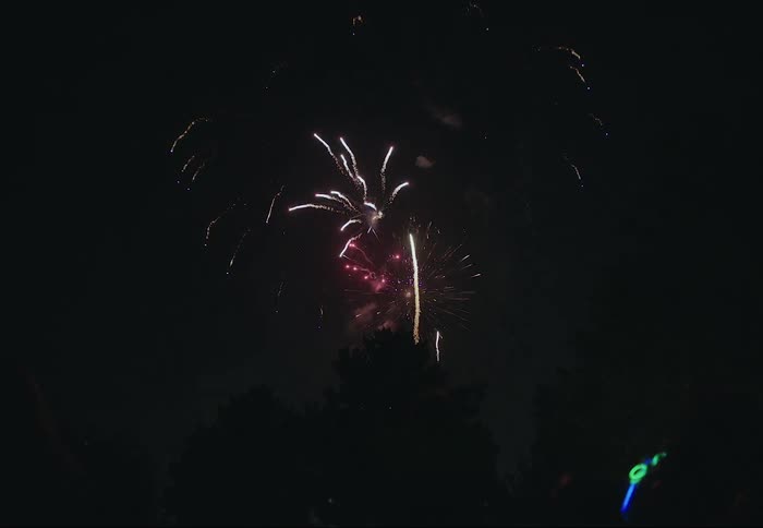 A fire work show is on display during the night