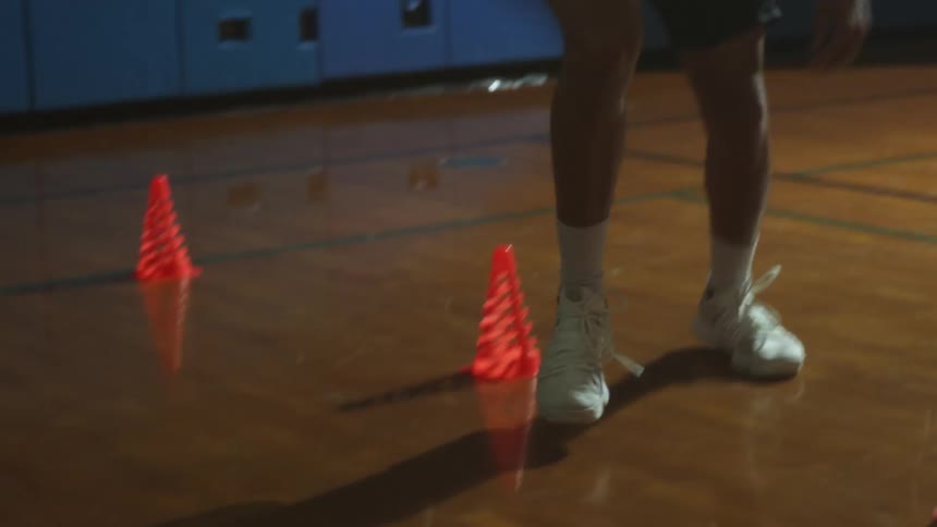 A person practicing basketball