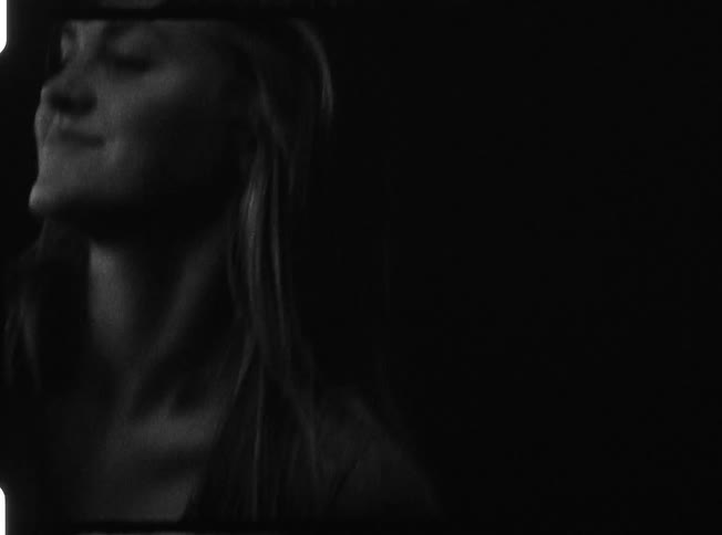 Close up of a woman dancing in the dark