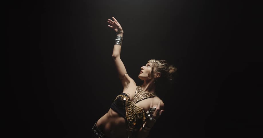 A woman is dancing by herself in a room