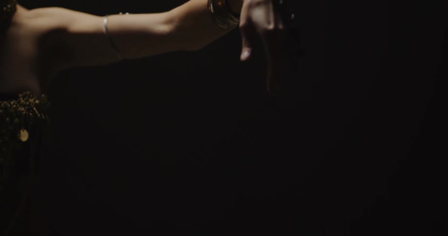 A woman is belly dancing