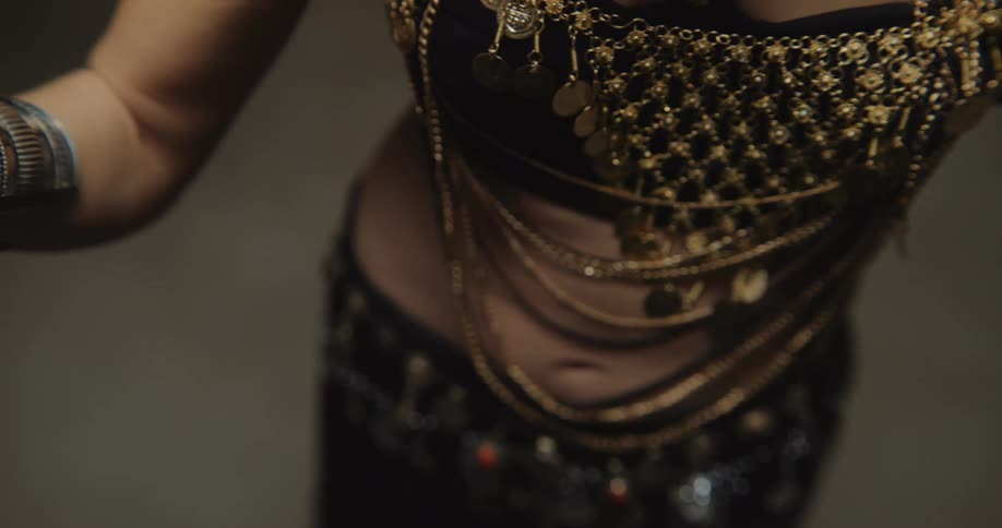 Close up view of a woman dancing by herself is displayed