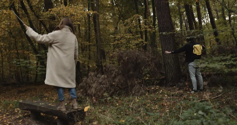 Two friends are walking through the forest together