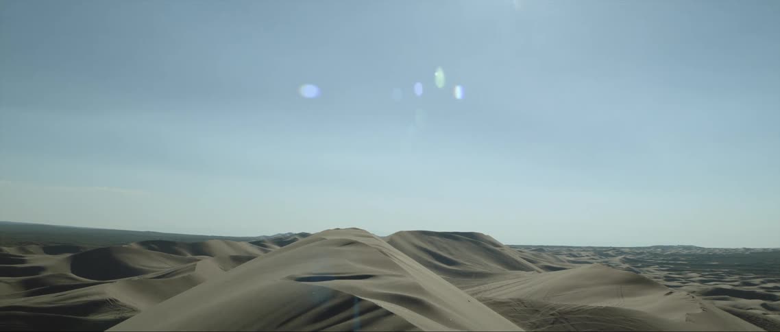 A barren desert landscape in the daytime