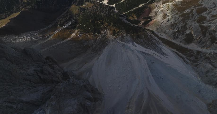 Aerial view of mountains during sunset is displayed