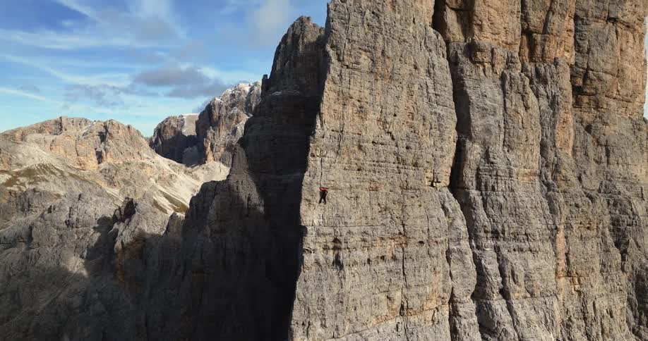 An aerial view of rocky cliffs and mountains in the wilderness