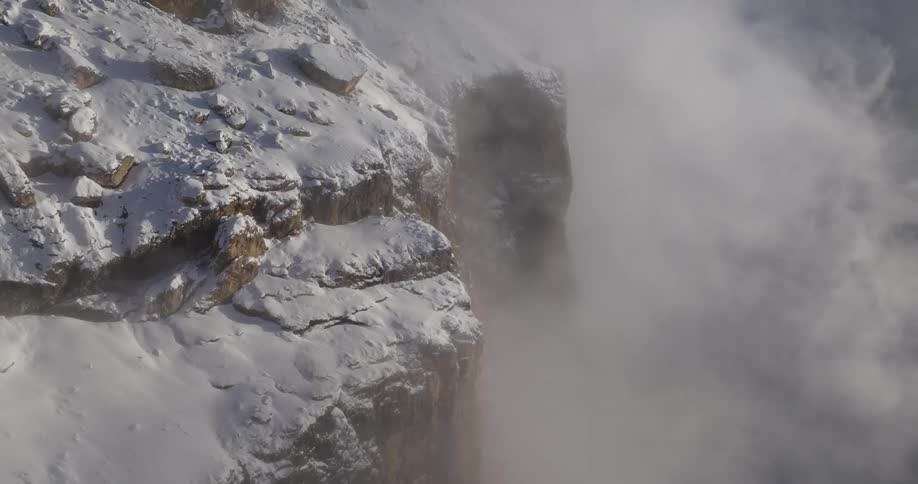 The view is of a mountain that is covered with snow in the winter time