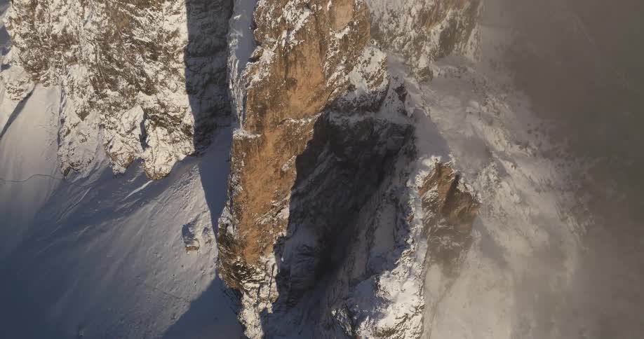 The view is of a cave that is covered in snow in the winter