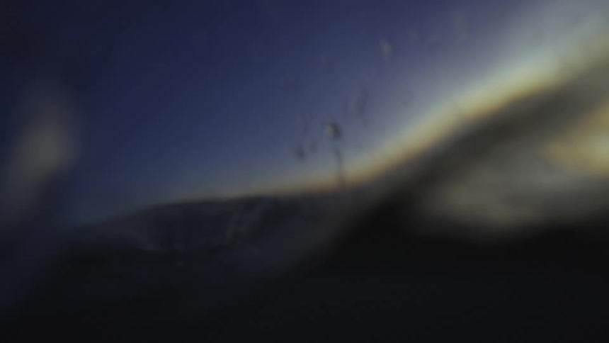 The wave crashes in the ocean