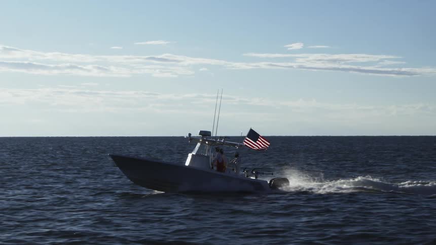 A boat sailing on a calm ocean