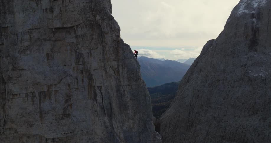 The view is of someone rock climbing in the day time