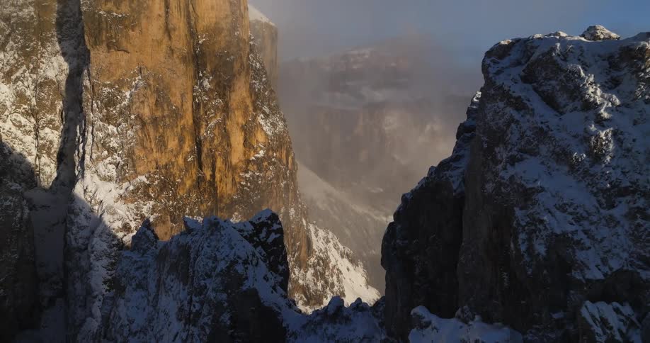 Aerial view of mountains at sunset is displayed