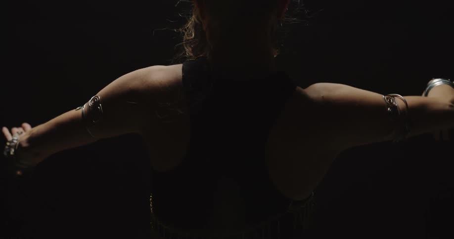 A woman is performing a dance by herself