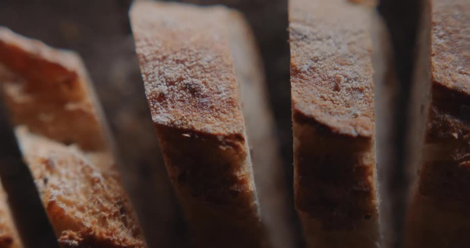 Thick crusty bread slices stand with space between