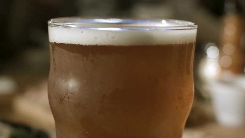 A glass is full to the top