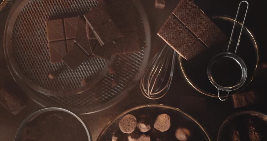 Cocoa powder settles over ingredients for chocolate candy