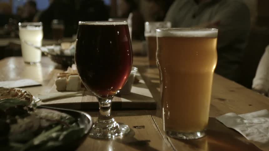 Two glasses of drinks on a table
