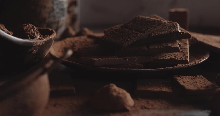 Chocolate powder is sprinkled on the chocolate bars