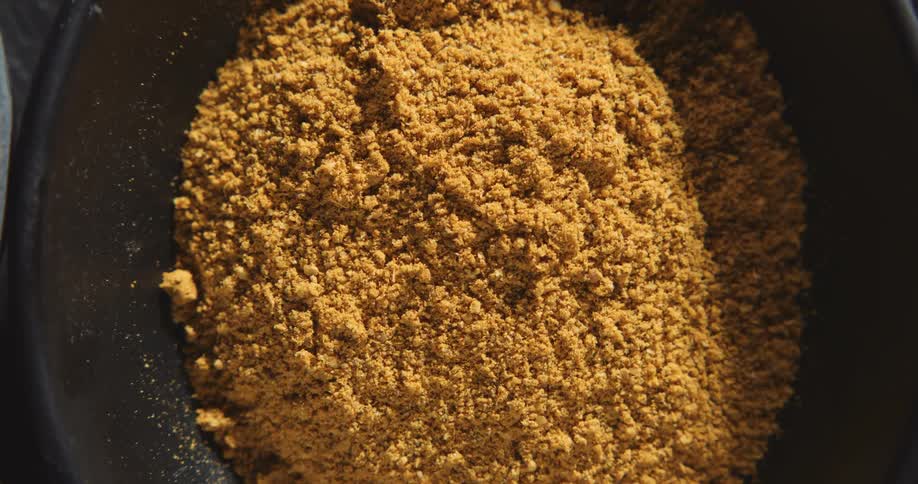Closeup of a bowl of cinnamon powder