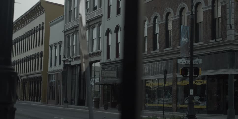 A town street is empty on a cloudy day