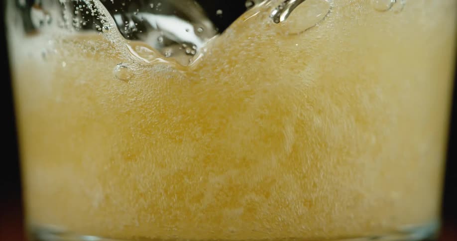 Close up of beer being poured into glass