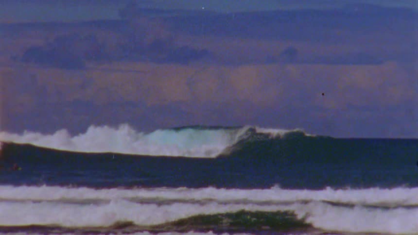 Ocean waves are displayed on film during sunset