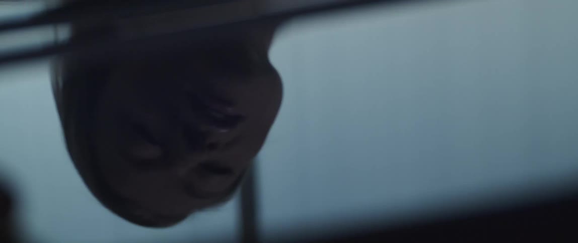 A silhouette reflection of a womans head