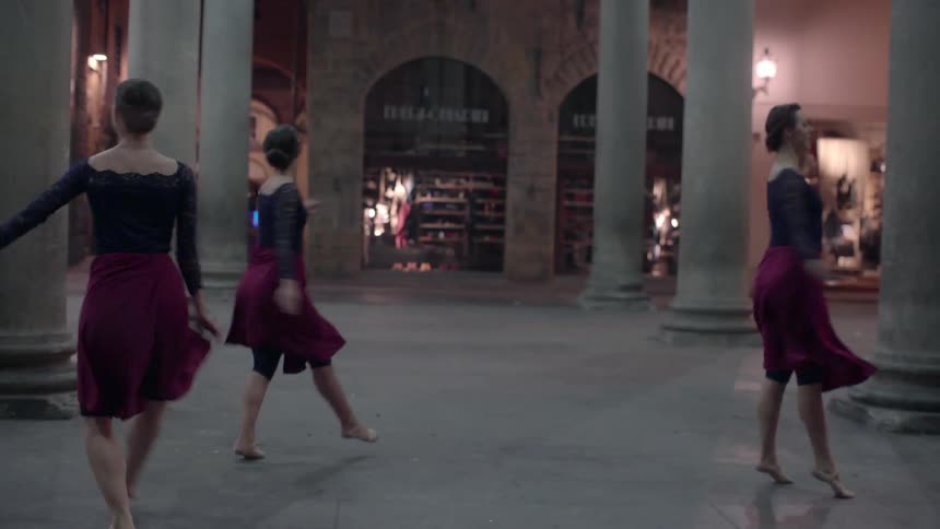 Dancers perform in a town square