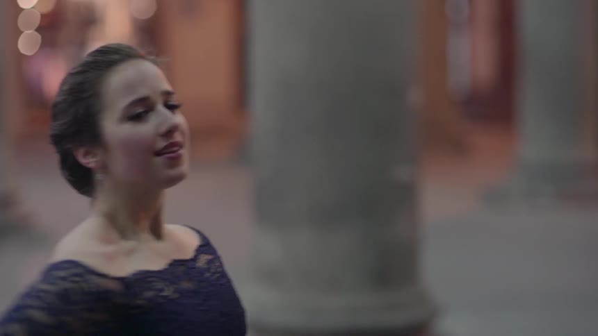 A woman is dancing outside
