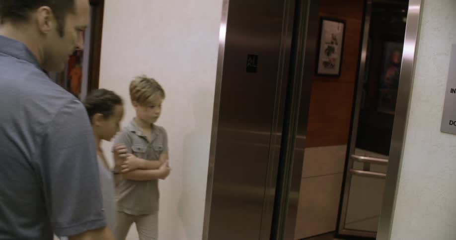 A large family get into an elevator